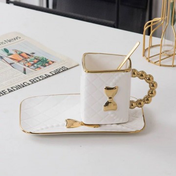 CHOPE CERAMIQUE EN FORME SAC A MAIN POIGNEÈ DORÈ AVEC SOUS TASSE -360ML- ≡ MINIMALL